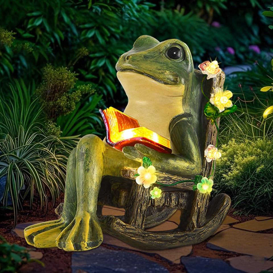 Vovkokc solar garden frog reading statue glows softly at night for cozy patios.