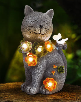 Vuees solar cat statue glows softly at night for a charming garden ambiance.