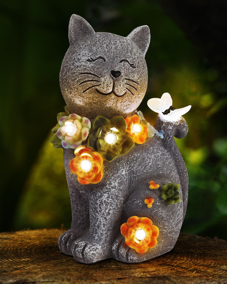 Vuees solar cat statue glows softly at night for a charming garden ambiance.