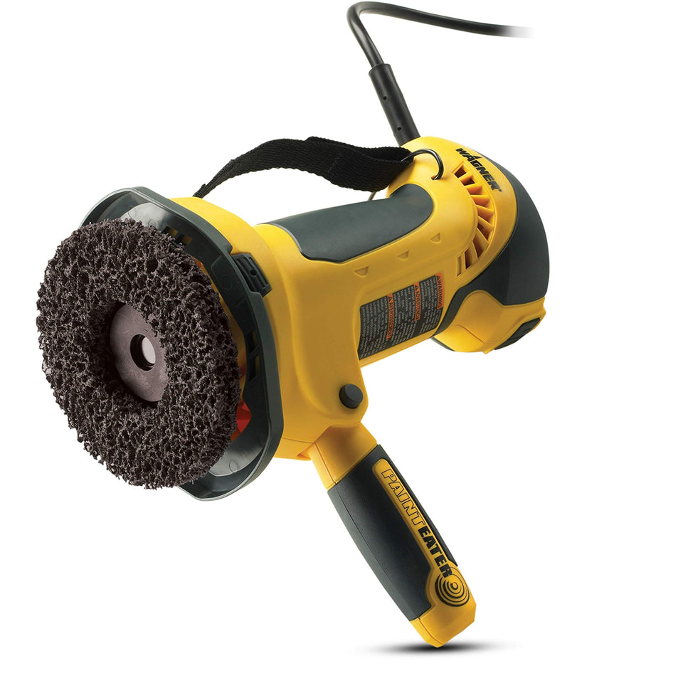 Wagner PaintEater 4-1/2-inch disc sander on exterior siding for efficient paint removal.