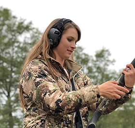 Walker's Razor Carbon earmuffs worn on head in outdoor setting