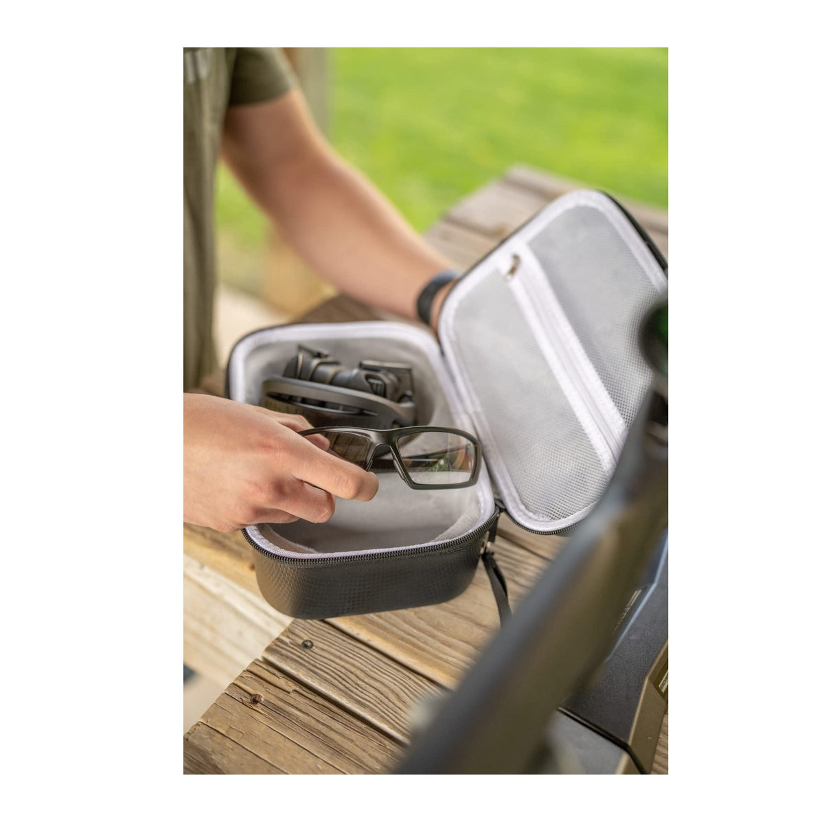 Walker's case features a comfortable hand strap and mesh pocket for accessories.