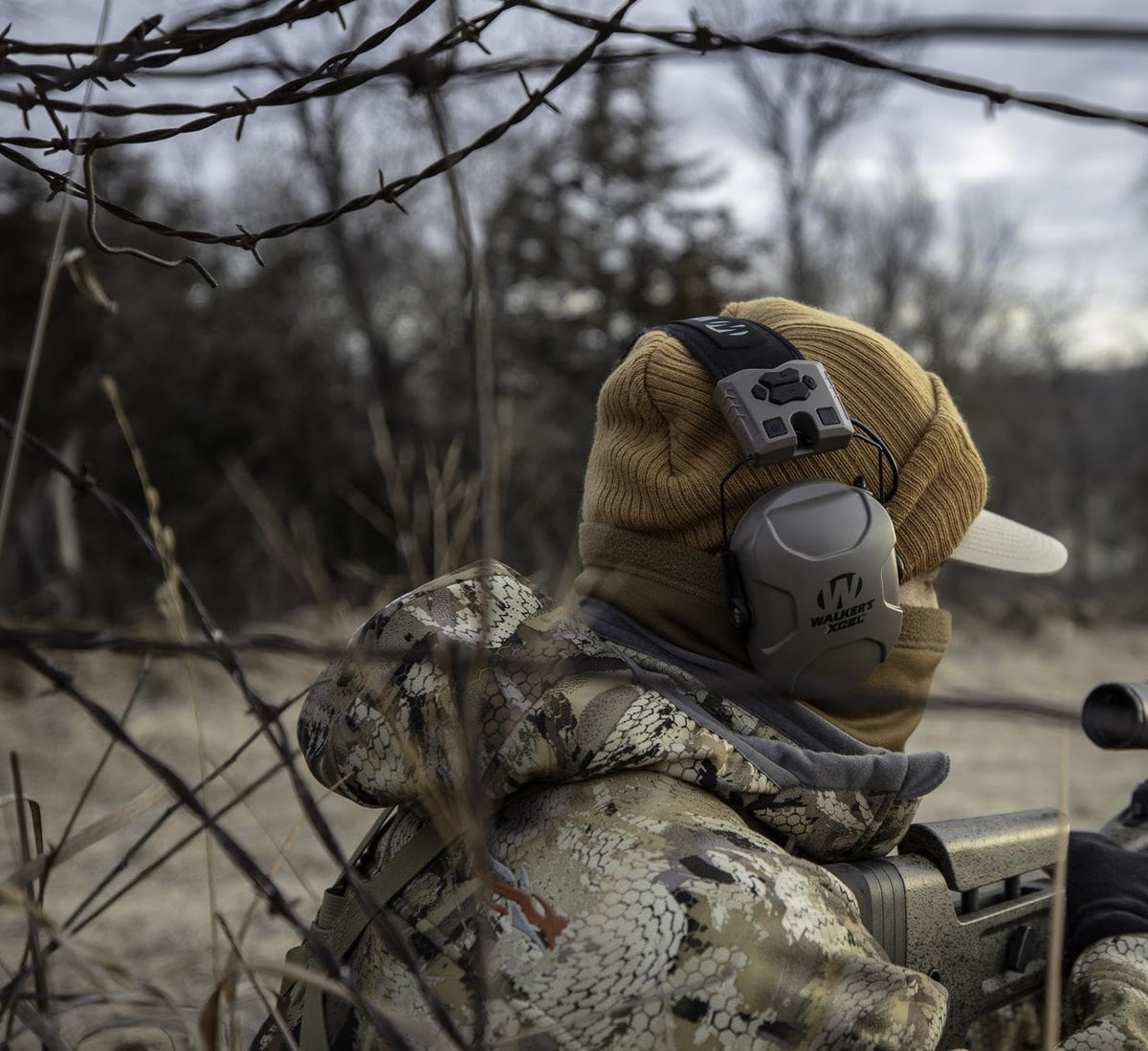 Walker's XCEL 100 digital muff side controls enable quick adjustments outdoors.