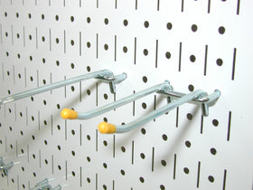 Wall Control pegboard installation on stud wall illustrating direct mounting without framing.
