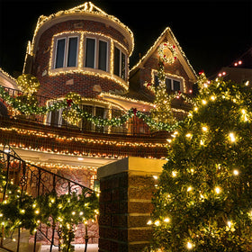 Waterglide warm white glow enhances trees and garden décor with a cozy ambiance.
