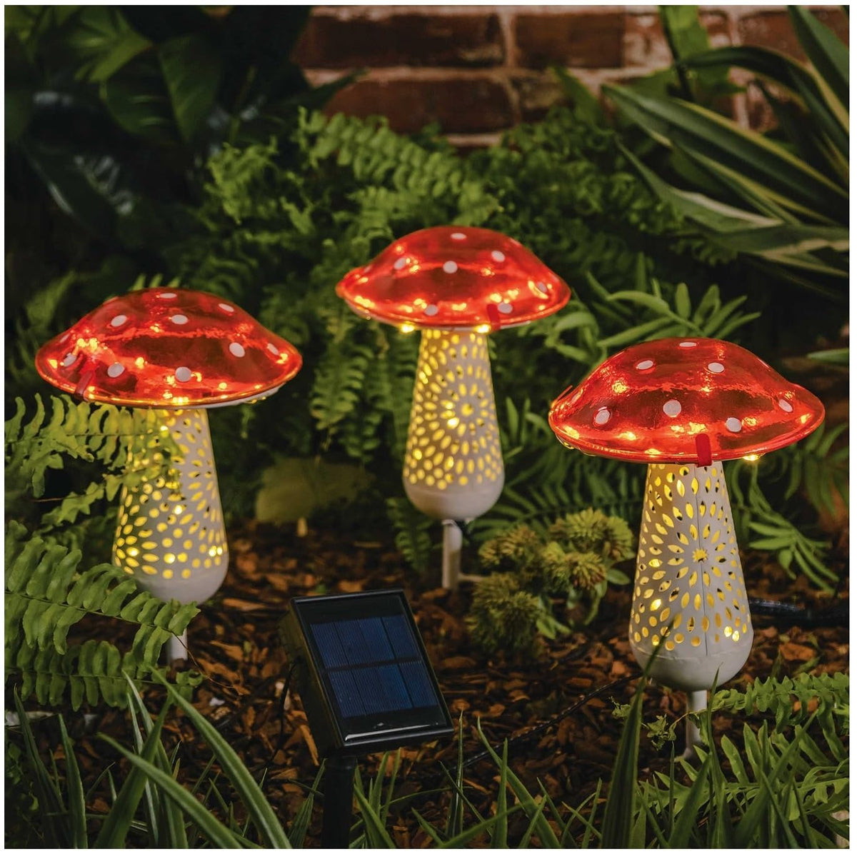 Way To Happiness giant red mushroom solar light on a 12-inch stake lighting a garden path