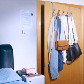 WEBI door hanger rack holds towels and clothes with anti-scratch padding.
