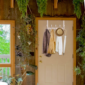 WEBI white finish over-the-door rack blends with décor and adds storage.
