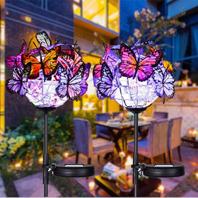 Weepong outdoor solar lights with 18 butterflies illuminate garden paths.