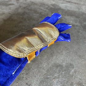Weldas aluminized layer reflects heat for cooler back-of-hand during welding