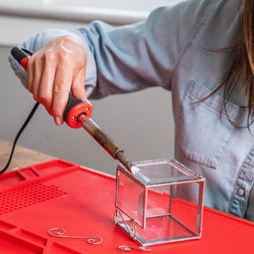 Heavy-duty soldering with Weller iron for robust repairs and stained glass work.