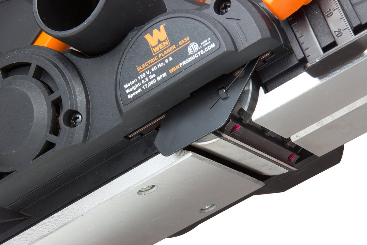 Dust bag attachment on WEN 6530 keeps workspace clean during use