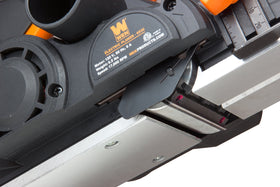 Dust bag attachment on WEN 6530 keeps workspace clean during use