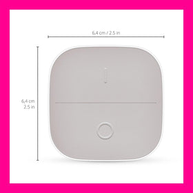 Person holding WiZ portable button to adjust lighting on the go
