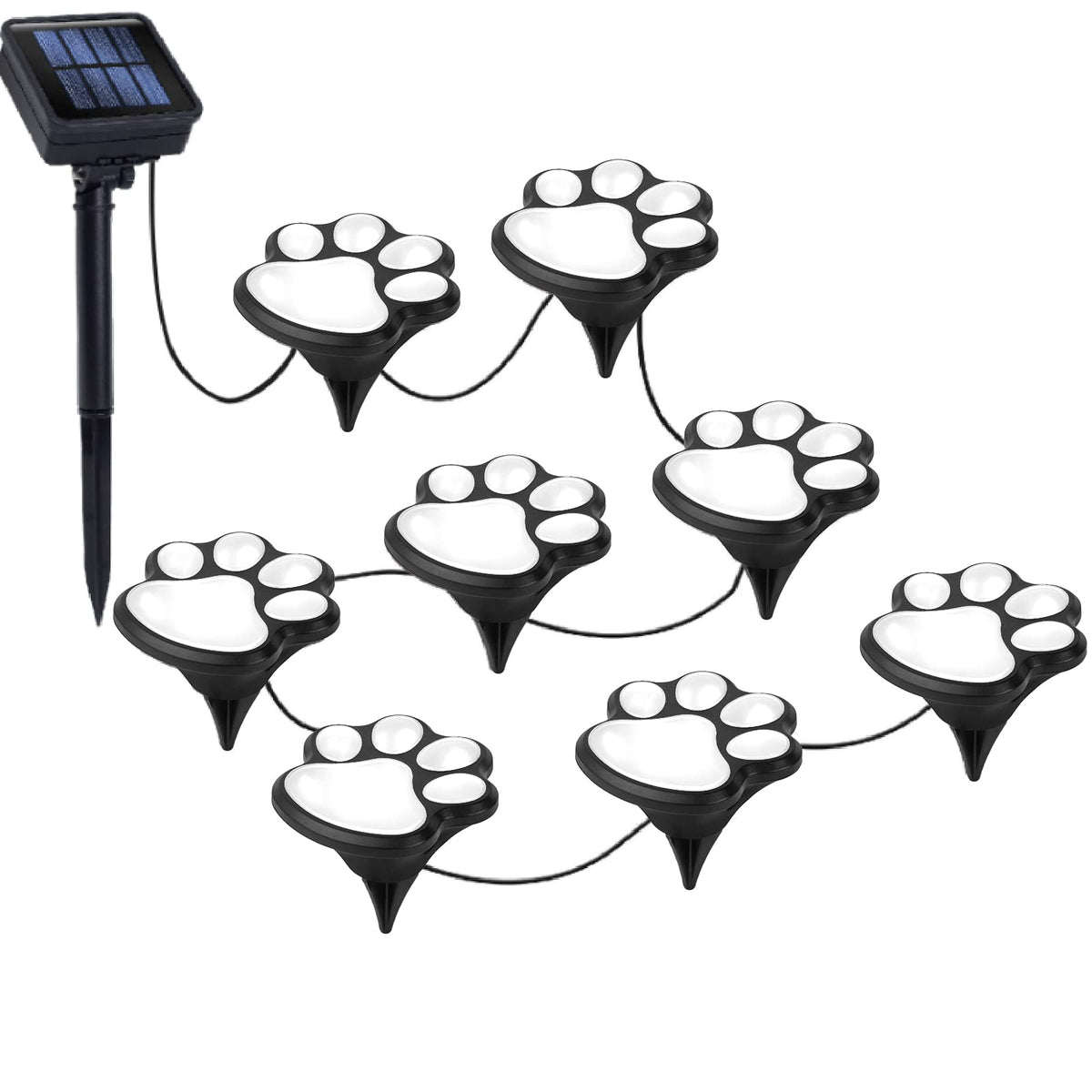 Wominoy paw print solar lights illuminate a garden path at night.
