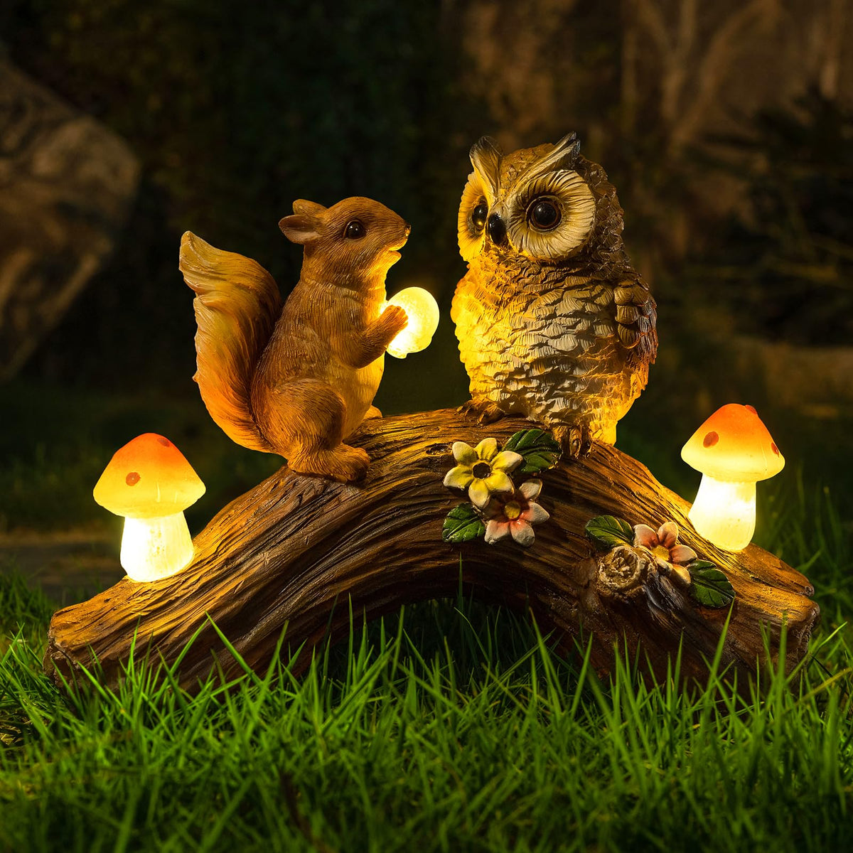WONDHOME solar owl statue illuminating a yard at dusk.