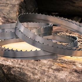 Wood-Mizer resharpening with a CBN wheel on the blade edge.