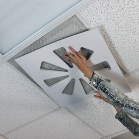 Wooden Shoe Designs ceiling vent deflector installed over a standard vent.