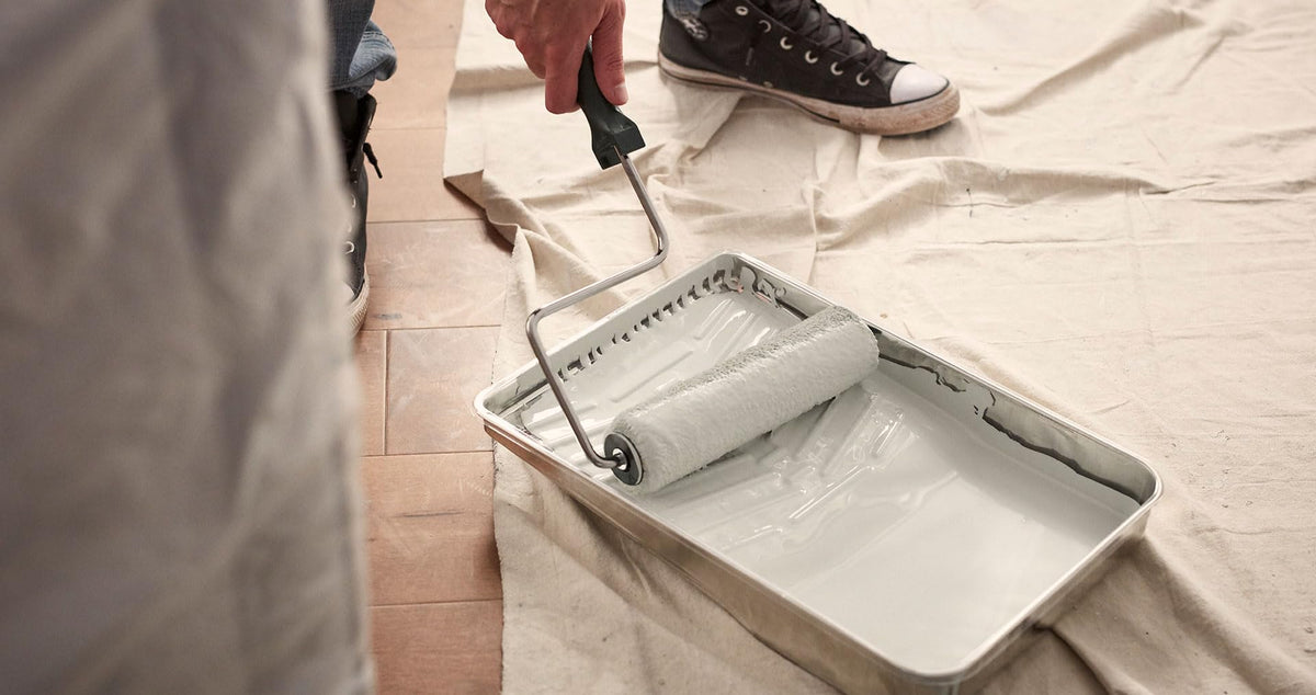 Security strap extended for larger hands during painting