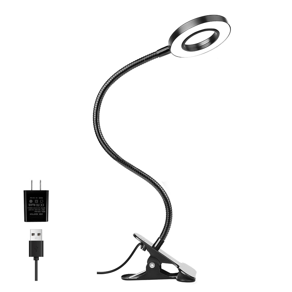 Woputne desk clip lamp clamped to a desk for focused reading.