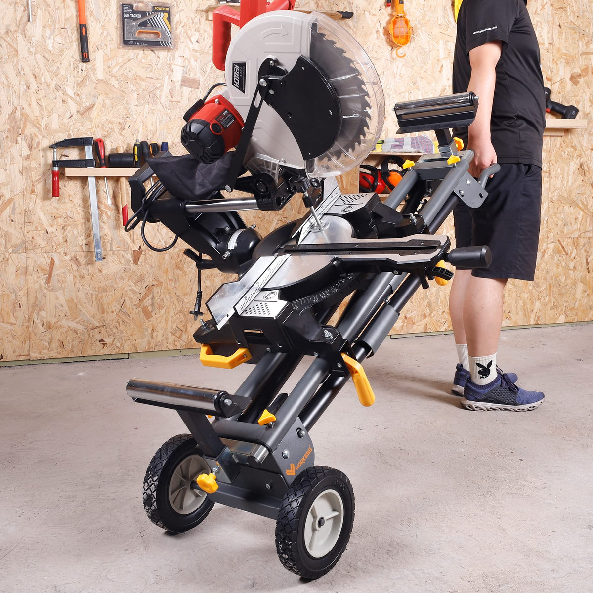 WORKESS quick-release brackets secure a miter saw to the stand.