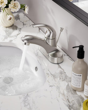 WOWOW faucet with pop-up drain assembly shown for convenient sink drainage