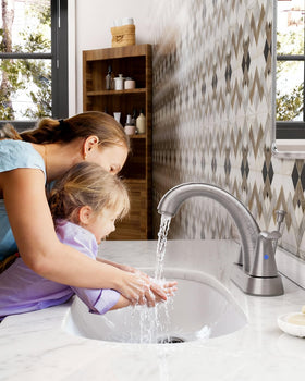 WOWOW bathroom faucet side view highlighting balanced profile and sturdy finish.