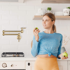 WOWOW brass pot filler with double swing arms for quick stove-top filling.