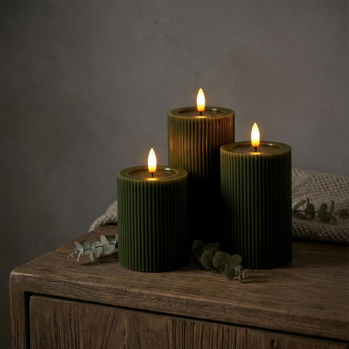 WYZworks fluted LED pillar candle 6-inch in Loden Green with realistic shimmer