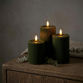WYZworks fluted LED pillar candle 6-inch in Loden Green with realistic shimmer