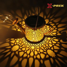 X-PREK garden lights with glass sphere bulb creating decorative flower patterns at night