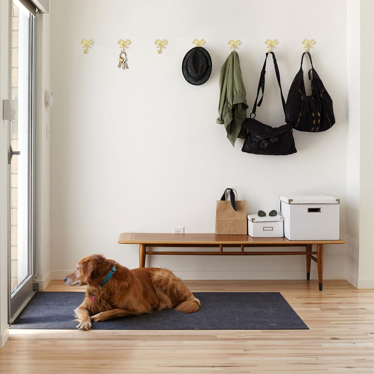 XHIPY gold bow wall hook suitable for kids room storage.