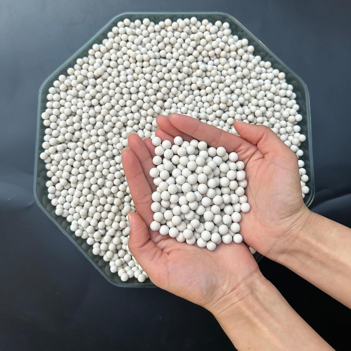 Pellets inside a container demonstrate refill-ready design from Xinhw.