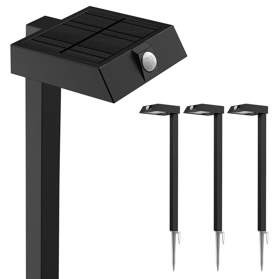 XMCOSY+ solar pathway lights 4-pack illuminate a garden pathway at dusk