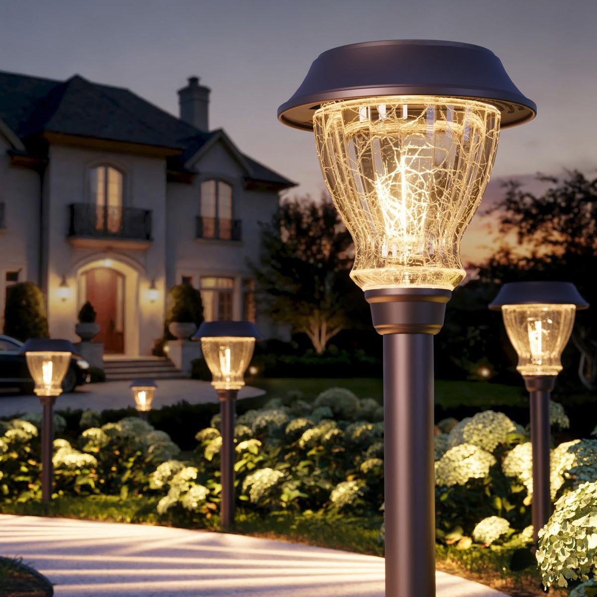 XMCOSY+ solar pathway light with crackled glass lens lights a walkway with warm glow