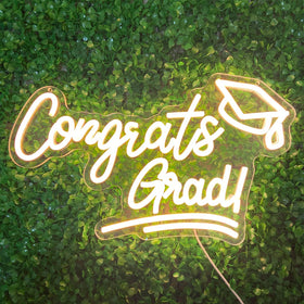 XMFRNIDV Congrats Grad Sign illuminated for vibrant graduation backdrops.