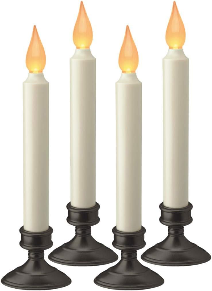 Xodus Innovations FPC1205A-4 window candle with amber flicker lighting a window.