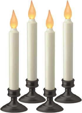 Xodus Innovations FPC1205A-4 window candle with amber flicker lighting a window.