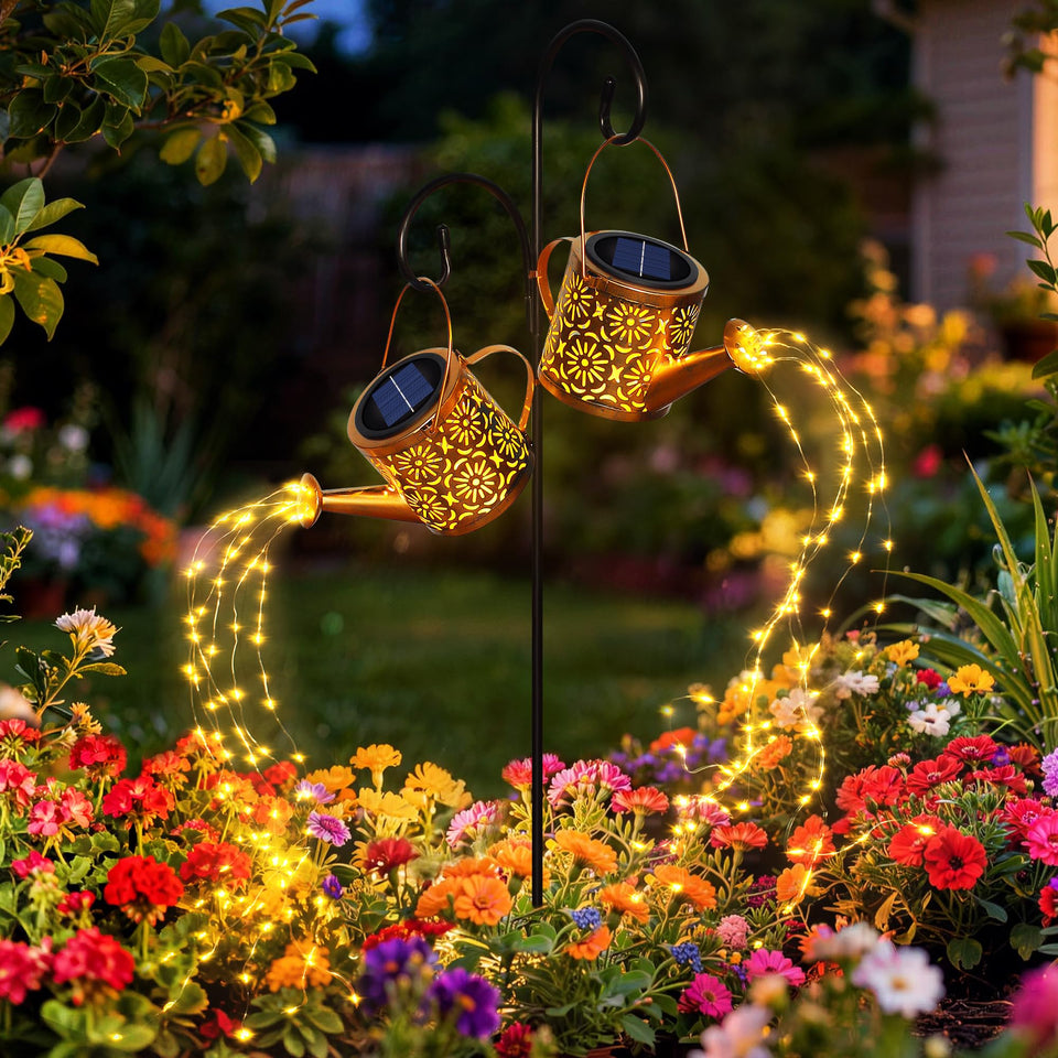 X-PREK solar watering can light top globe casts warm glow along the path