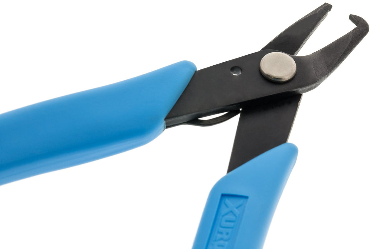 Xuron 496 pliers seen in hand during ring installation