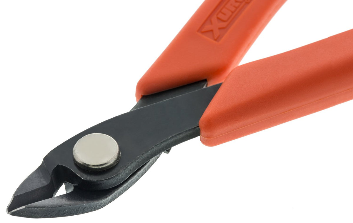 Xuron Maxi-Shear 2175 cutting tiger tail wire for durable bead strings.