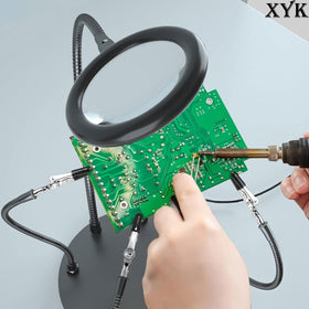 XYK Packaging includes base, magnifier, arms, and tools