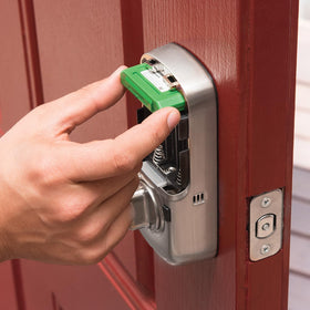 Yale Assure Lock being installed on standard door with screwdriver