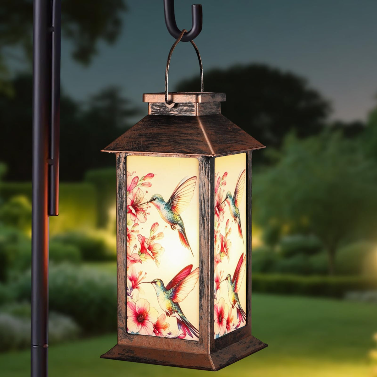 Yamodoor hanging solar lantern with hummingbird pattern for warm evening ambiance.