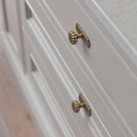 Yanxia antique-brass drawer pulls with backplate ready for easy upgrades.