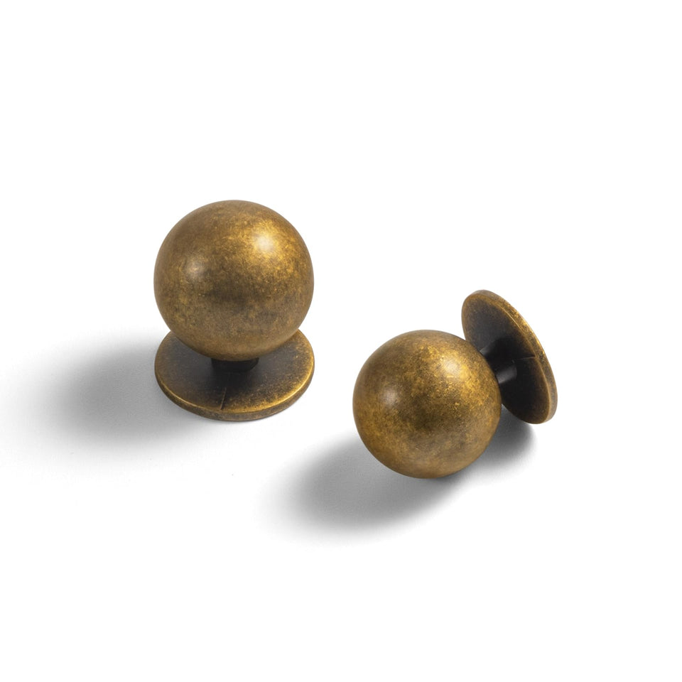 Yanxia round antique brass knob close-up with vintage charm for cabinets.
