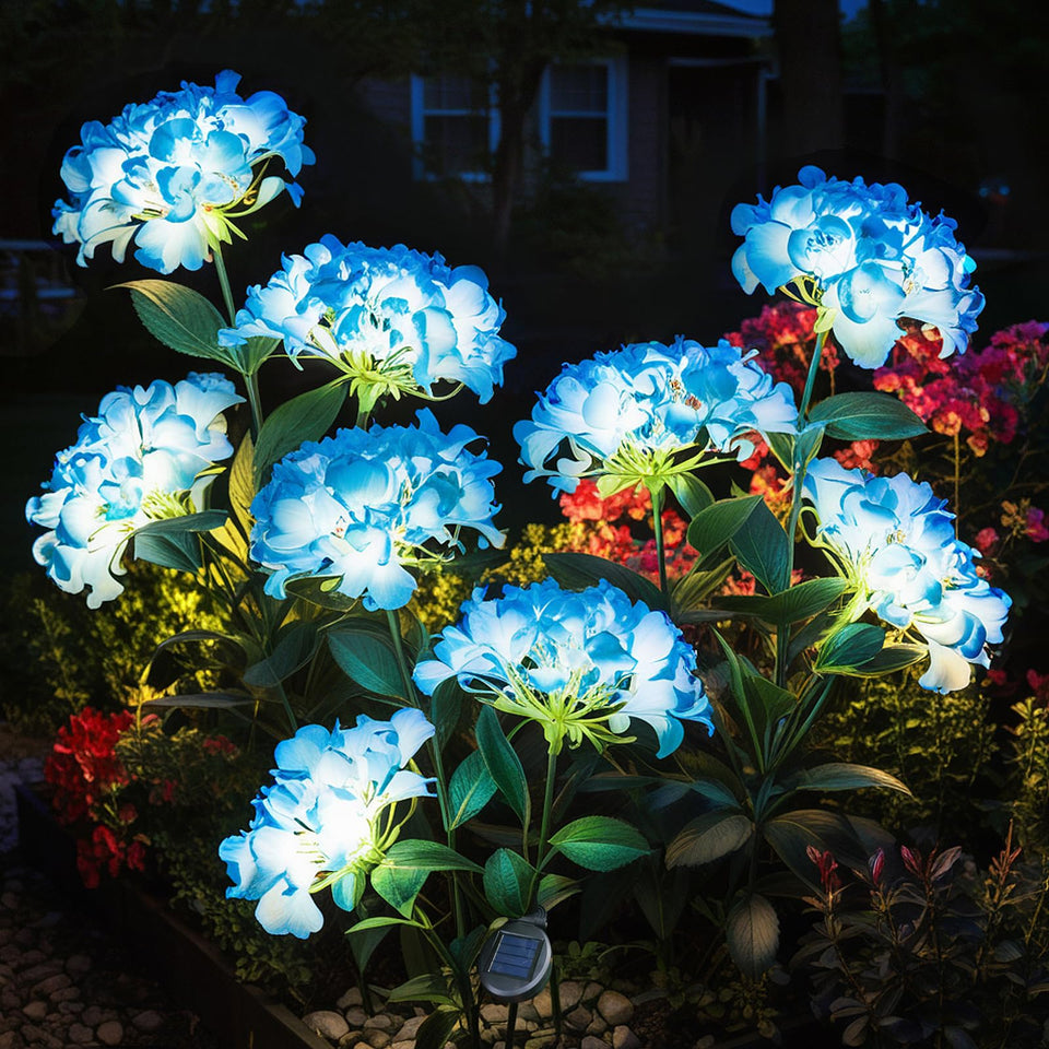 YAODEMA garden lights solar flower blue two-pack glowing along a walkway