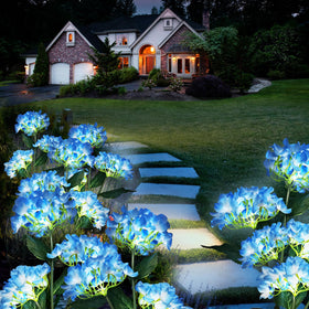 YAODEMA LED solar flower light illuminating a path and patio