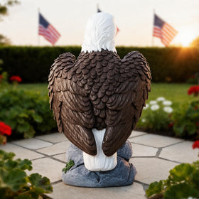 Eagle statue placed on patio, creating a striking outdoor focal point
