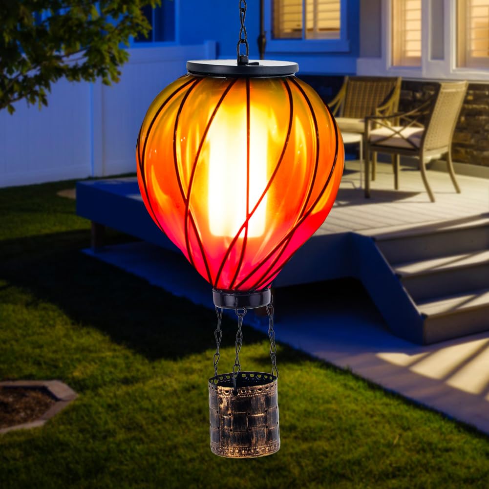 YELENEW glass balloon lantern at dusk adds decorative lighting to outdoor space.